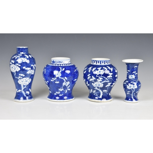 1527 - Four Chinese blue and white prunus blossom decorated vases, 20th century, comprising an inverted bal... 