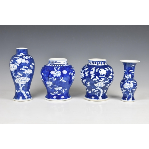 1527 - Four Chinese blue and white prunus blossom decorated vases, 20th century, comprising an inverted bal... 