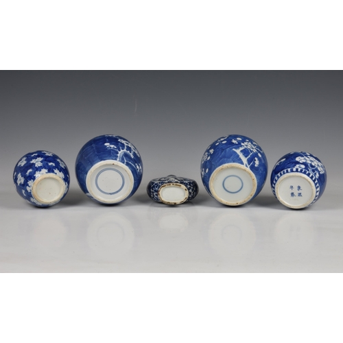 1528 - Four Chinese blue and white prunus blossom ginger jars, 20th century, three with dentil band to the ... 