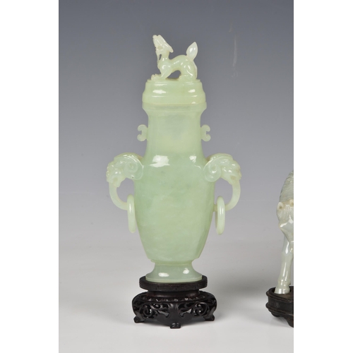 1542 - Three Chinese jade style hardstone carvings, 20th century, comprising a covered tripod censer, in pa... 