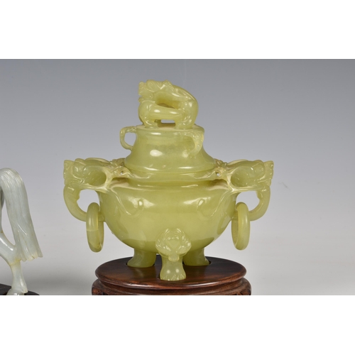 1542 - Three Chinese jade style hardstone carvings, 20th century, comprising a covered tripod censer, in pa... 