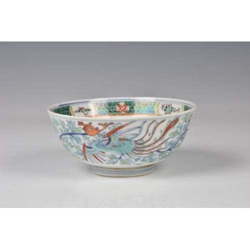 1545 - A Chinese porcelain doucai phoenix bowl, four character seal mark, probably 19th century, with round... 