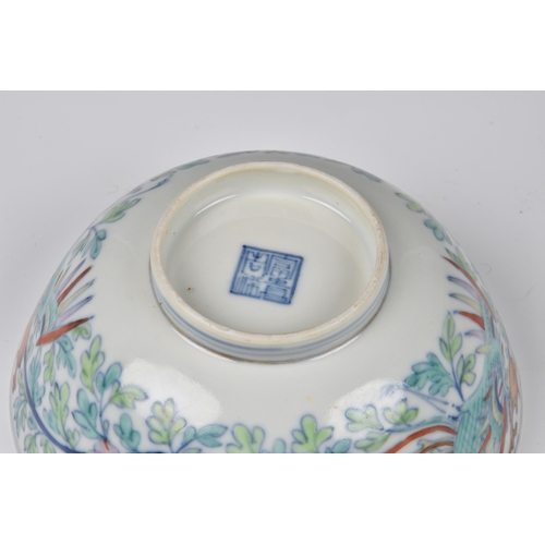 1545 - A Chinese porcelain doucai phoenix bowl, four character seal mark, probably 19th century, with round... 