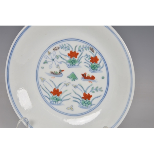 1549 - A Chinese doucai 'duck and lotus pond' porcelain dish, four character mark within double concentric ... 