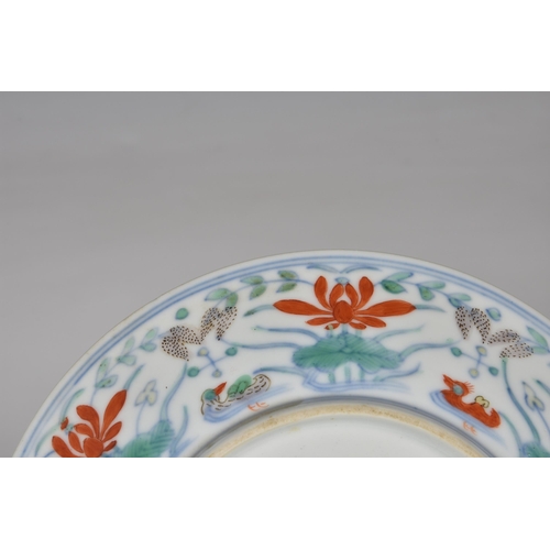 1549 - A Chinese doucai 'duck and lotus pond' porcelain dish, four character mark within double concentric ... 