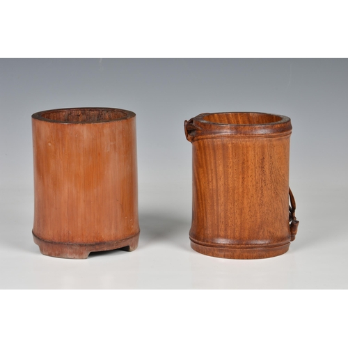 1552 - Two Chinese carved wooden brush pots, 20th century, one in bamboo, delicately carved with with a pai... 