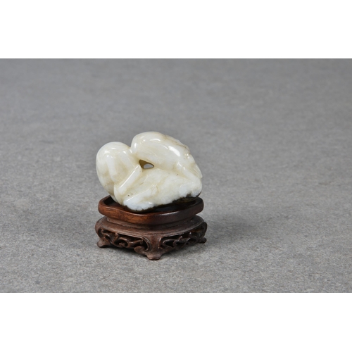 1553 - A Chinese pale grey and dark brown jade group of three kid goats, probably Qing dynasty, the three g... 