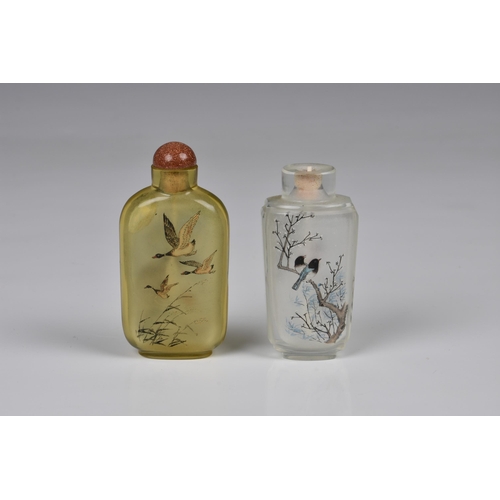 1558 - Two Chinese inside painted glass snuff bottles, 20th century, one in pale amber glass, painted with ... 