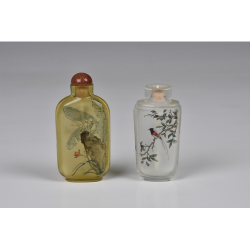 1558 - Two Chinese inside painted glass snuff bottles, 20th century, one in pale amber glass, painted with ... 