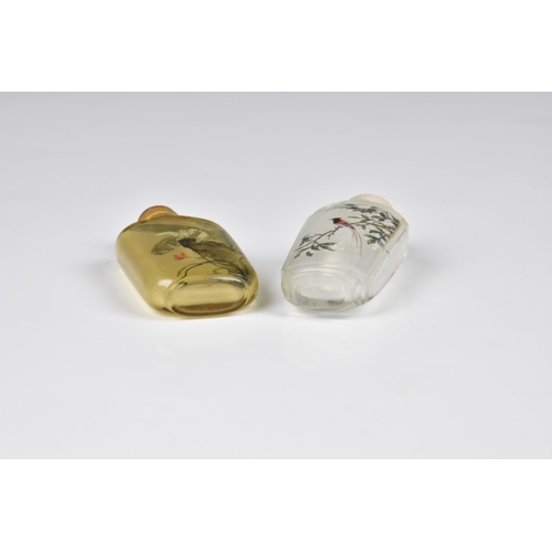 1558 - Two Chinese inside painted glass snuff bottles, 20th century, one in pale amber glass, painted with ... 