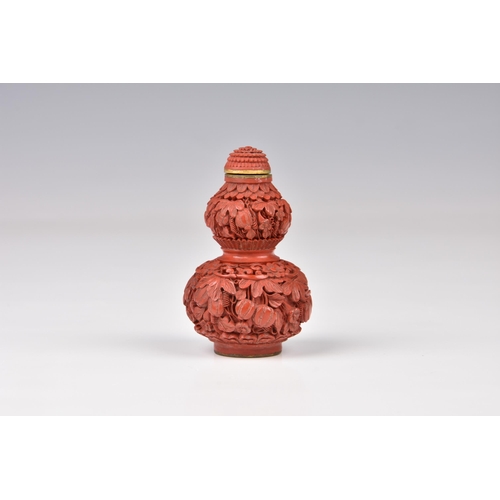 1560 - A Chinese carved cinnabar lacquer double gourd snuff bottle, the base with incised Qianlong seal mar... 