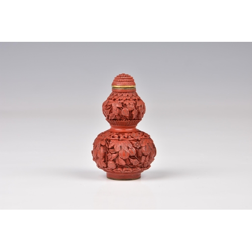 1560 - A Chinese carved cinnabar lacquer double gourd snuff bottle, the base with incised Qianlong seal mar... 