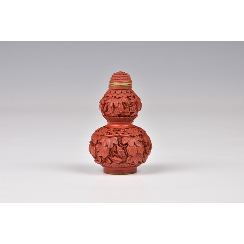 1560 - A Chinese carved cinnabar lacquer double gourd snuff bottle, the base with incised Qianlong seal mar... 