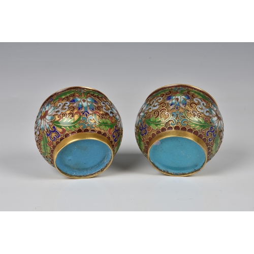 1572 - A pair of miniature Chinese gilt metal champleve enamel covered jars, 20th century, of globular form... 