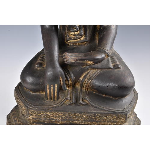 1586 - A 19th century Burmese Mandalay dry lacquer seated figure of Buddha, seated in dhyanasana on a tiere... 