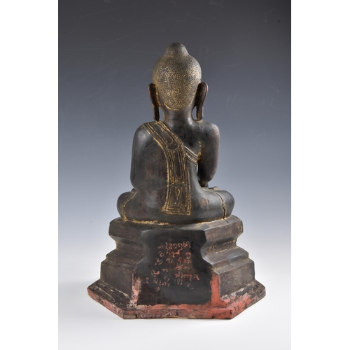 1586 - A 19th century Burmese Mandalay dry lacquer seated figure of Buddha, seated in dhyanasana on a tiere... 