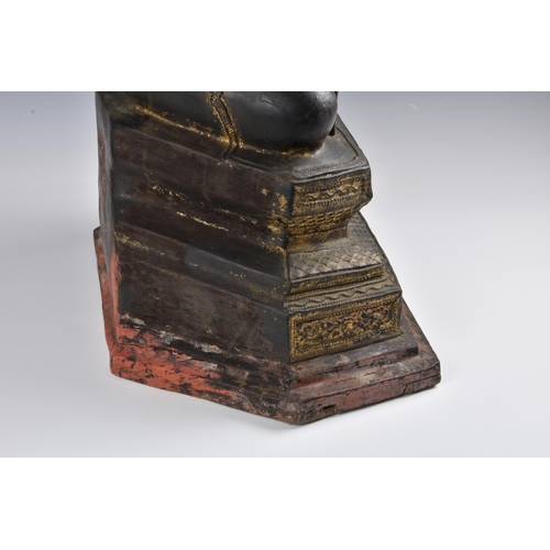 1586 - A 19th century Burmese Mandalay dry lacquer seated figure of Buddha, seated in dhyanasana on a tiere... 