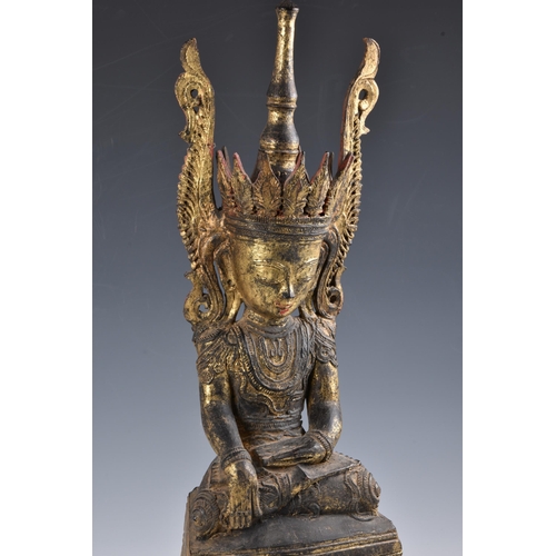 1587 - A Burmese, Shan States style carved gilt decorated Buddha, probably 19th century, the carved wooden ... 