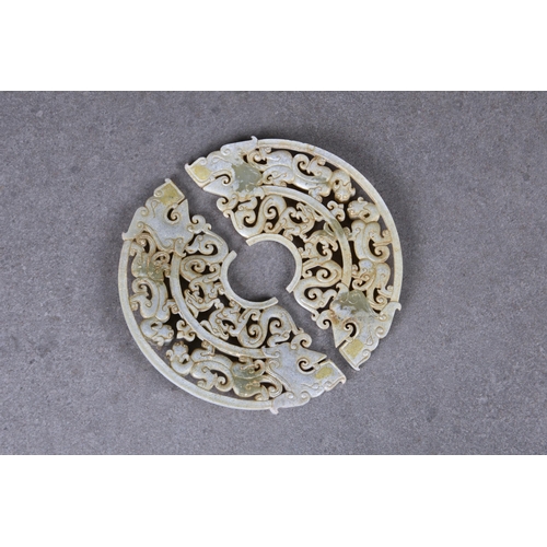 1609 - A pair of Chinese celadon jade dragon disc pendants, in the Han Dynasty style, but probably 20th cen... 