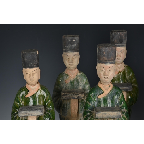 1619 - A set of eight Chinese Sancai glazed pottery tomb figures of Court Attendants, with separate, unglaz... 