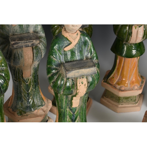 1619 - A set of eight Chinese Sancai glazed pottery tomb figures of Court Attendants, with separate, unglaz... 