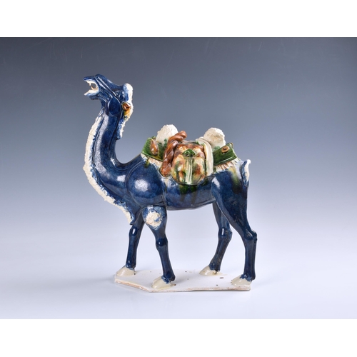 1627 - A Chinese sancai glazed, Tang Dynasty style figure of a caparisoned camel, 20th century, the camel i... 