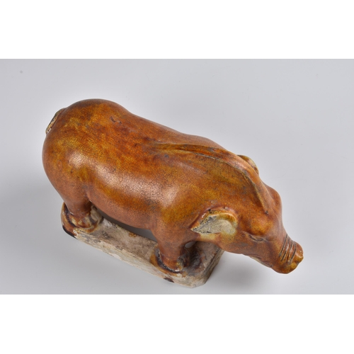 1629 - A Chinese chestnut glazed model of a boar, probably Tang Dynasty (618-907), the glaze with a file cr... 