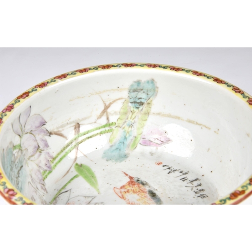 1654 - A Chinese famille rose porcelain bowl, early 20th century, decorated with Kingfisher amidst flowerin... 