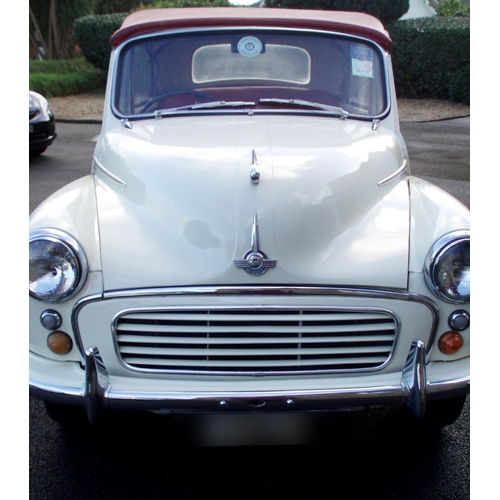 1770 - A 1960 Morris Minor Convertible, cream paintwork with red pinstripe, contrasting red interior and bo... 