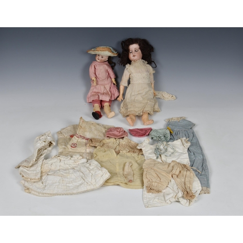 1773 - An early 20th Century French SFBJ bisque headed doll, with painted features, 13in., together with an... 