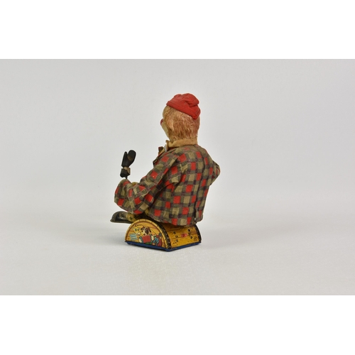 1775 - A vintage Circus Clown toy, by ALPS, 1950s, battery operated, with cloth red cap and red and black c... 