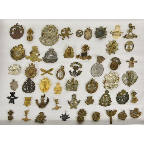 1780 - A large collection of approximately one hundred & thirty (130) various Military cap badges / patches... 