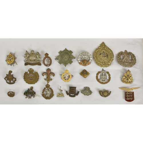 1780 - A large collection of approximately one hundred & thirty (130) various Military cap badges / patches... 