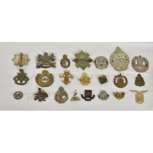 1780 - A large collection of approximately one hundred & thirty (130) various Military cap badges / patches... 