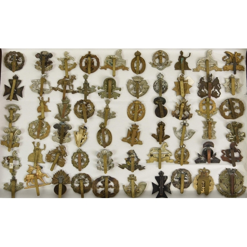 1791 - A large collection of approximately seventy five (75) various Military cap badges, to include Office... 