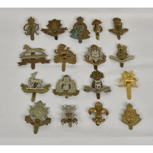 1791 - A large collection of approximately seventy five (75) various Military cap badges, to include Office... 