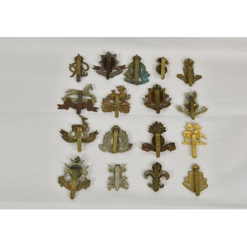 1791 - A large collection of approximately seventy five (75) various Military cap badges, to include Office... 