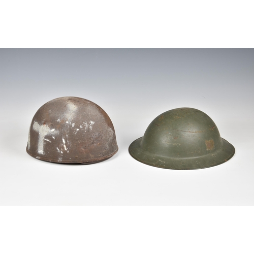 1827 - An American army steel helmet, and a British Brodie helmet. (2)  Both with wear and signs of rust et... 