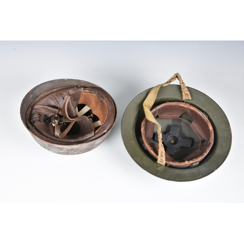 1827 - An American army steel helmet, and a British Brodie helmet. (2)  Both with wear and signs of rust et... 