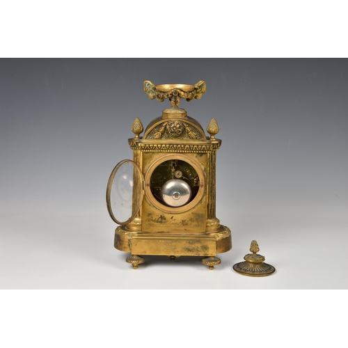 1945 - A 19th century French ormolu half hour striking mantel clock, the case with a urn finial with remova... 