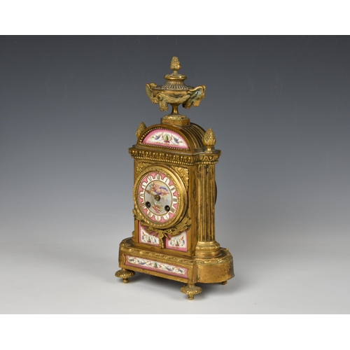 1945 - A 19th century French ormolu half hour striking mantel clock, the case with a urn finial with remova... 