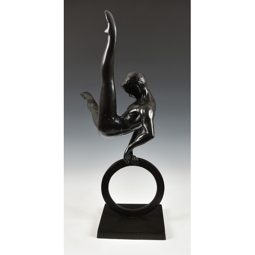 1971 - A large contemporary patinated bronze Male Gymnast sculpture, the gymnast performing flare on a ring... 