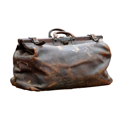 1983 - A large leather Gladstone bag by C. Donaldson of Glasgow, in mid-brown leather, with double top hand... 