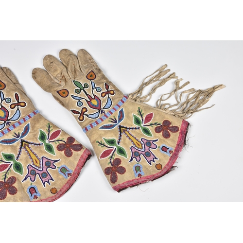 1993 - North American Indian interest - a 19th century pair of Woodlands womens gauntlets, floral designs ... 