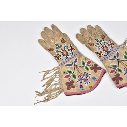 1993 - North American Indian interest - a 19th century pair of Woodlands womens gauntlets, floral designs ... 