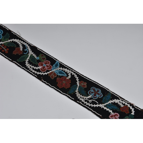 1994 - North American Indian interest - a 19th century Woodlands beaded sash, floral designs in red, white,... 