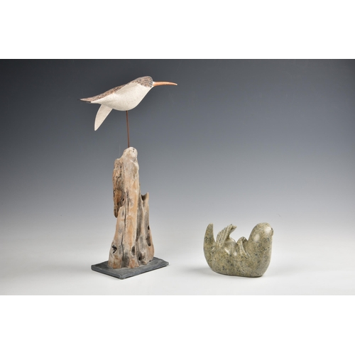 2078 - A decoy style carved and painted wooden sculpture of a curlew in flight, on a driftwood stand with s... 