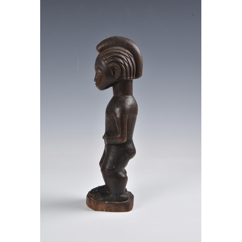 2088 - A Baule standing male figure, Ivory Coast, West Africa, probably mid-20th century, the carved wooden... 