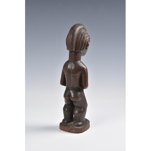 2088 - A Baule standing male figure, Ivory Coast, West Africa, probably mid-20th century, the carved wooden... 