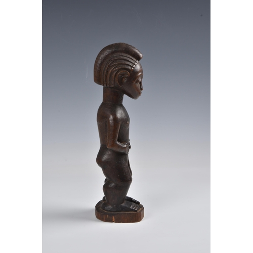 2088 - A Baule standing male figure, Ivory Coast, West Africa, probably mid-20th century, the carved wooden... 